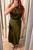 This dress is absolutely gorgeous. The material is perfect and such high quality. I got the olive green color and have never gotten so many compliments on a dress! I ordered both a large and an extra large, and ended up wearing the extra large just to be more comfortable and not feel like I had to be sucking everything in all night haha. If you are between sizes, I would order one up unless you like it to be more form fitting in the waist and hips. There is plenty of room up top. There is no stretch to the satin fabric. I wore a one-piece bra/shorts spanx type thing underneath and it was perfect! - Anna W.