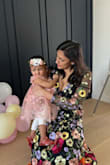 Bought this for my daughter's first birthday. Worked perfectly with the floral theme! Loved the fit. The fabric is sturdy without being heavy/scratchy. The flowers are a mix of embroidery and cut-outs, which makes the dress stand out. I got tons of compliments! - Sugandha M.