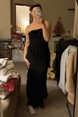 I almost ordered a Medium but I'm glad I trusted my gut and got a small. The dress itself fits well, and the bust area is not too large. I am literally an A cup. The dress is flattering in the stomach area as well.  These photos were taken right before I moved so excuse the mess - Hannah B.