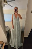 This dress is much larger than expected. It's very heavy and honestly felt like wearing a comforter. Bust ran a little large too. - Allison B.
