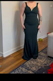The fit is amazing. I recently had a tummy tuck and wanted to show off my new curves with this beautiful dress. It hugs all the right places. I haven't worn to the wedding yet but I have tried on. I definitely love the dress, I can see where the sleeves will be a little annoying but for one evening it will work. Definitely buy boobie tape, maybe dress tape for the straps. Besides that beautiful dress! - Joretta G.