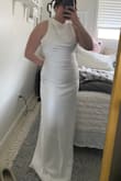I ordered this dress for my wedding elopement and it's perfect! The back is open and very pretty. I even got it delivered well before the date I was expecting! I'm on the shorter side but with some small heels the dress will be awesome. Love Lulus - Rachel G.