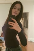 I ordered up a size S per other reviews and it fit perfect. I didnt find it too small or short at all but I have a short torso. Very nice pratical top you can dress up or down. - Laura D.
