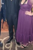This dress was beautiful and I received many compliments on it. The only negatives are that the straps fall down and the top is not stretchy. Beautiful nonetheless! Definitely recommend. - Marisol B.