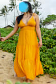I love the color of this dress! It's like an orangey yellow. The buttons are really annoying. I love the look of it, but I hated buttoning them. Would order this dress in different colors, and if it had fake buttons. I wore this dress on my honeymoon in Hawaii and it photographed well! I am 5'1 so this was more of a maxi dress for me. - Vannyda K.