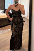 Pretty, but just didn't love the style on me. Fit true to size. I went with the Dedicated to Glamour Dress instead, which I absolutely loved. - Laura O.