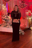 I'm not a huge fan of wearing all black but I was drawn to the dress. Got it for a wedding and I felt sexy, elegant, classy plus I was comfortable. Doesn't break the bank either. Sleeves were slightly big I might of gotten away with a medium (as I'm kinda in between sizes) but it would have been uncomfortable to use the bathroom smaller. Everyone complimented me on it. The dress is a show-stopper. I must buy! I'm wide hips and it legit shaped my body perfectly. Purse from Lulus also. - Tania P.
