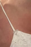 The lace is torn and it's ineligible for return - Kelly H.