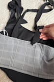My daughter wanted to wear it with new jeans and she couldn't even tie the straps. They ripped immediately after she put it on. Super cute, unfortunately not what we expected. - Marcela P.