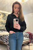 I love this too. I love that it's cropped but not awkwardly so and sits just right on the waist with a pair of high waisted jeans. I bought this to have as a casual collared work shirt. - Kristen H.
