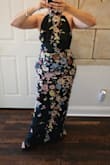 Beautiful dress but the pattern of the dress did not match the picture.  The top had flowers on one side and not on the other.  The middle flower design was crooked.  Beautiful back though - Lilliana P.