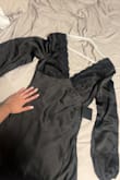 I am normally a size medium, but I decided to size down based on the reviews. It fits perfectly. I wore it for a date night and loved it! The sleeves are long but nothing that can't be fixed.  It is a little tight on the rib cage area (where my hand is)  and it is not very stretchy, so if you have a wider rib cage, I'd recommend getting your normal size. - Gresia L.