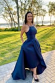 I purchased this dress in size M, but it was very large so I exchanged it to a size S. It fit me absolutely perfectly for the exception of the bust area as it was a bit tight. The length was perfect for my height (5'4") and I was wearing 6 inch heels. The material is amazing and it was very well done. I would recommend this dress to a wedding guest or black tie event. - Stephanie R.