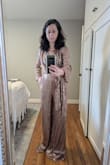 I love this piece, it is flattering, fits true to size and feels both warm and comfortable.
The color is darker than pictured though - it's more bronze than pink.
Giving it 4 stars, I had to get it altered. The legs ran way too long and the decolletage was too open for me to perform in it. - Aurelia L.