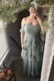 I was not disappointed and cannot wait to wear this to an upcoming wedding! I was nervous it wouldn't fit my larger chest (32G). I gives me perfect coverage. Fits true to size per my measurements. The straps are a bit long and I can't tighten them anymore. I will most likely have them altered or drape them like my photo. - Jessica V.