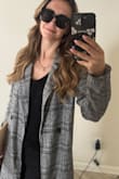 Not heavy but offers a little warmth and would be easy to layer, it's a very charming coat that looks great with a lot of options! - Hailey G.