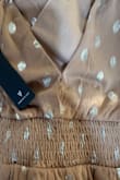 Dress seems really pretty, ordered a small but too baggy by my bust. Also large hole/rip in back when unwrapped. Returned. - Jodi H.
