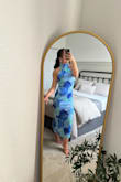This dress is a 100/10! I plan to wear it for a Key Largo beach wedding and it's absolutely PERFECT for the occasion, paired with these Lulus drop earrings. I plan to wear it with white strappy heels. 

I'm wearing a size small (5'4", 134 lb, 34DD, 25 in waist, athletic build) and it fits like a glove. The material has a small amount of stretch and the ruching in the midsection is very forgiving. The open back is *chefs kiss*

Seriously, do yourself a favor and add to cart immediately! - Nicki T.