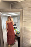 I ordered this for a wedding and I love it! I ordered it in a large and needed to size down to accommodate my bust (34B) - Hope L.