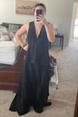 I ended up going with another dress, but this one was still beautiful! slightly tight around the rib cage and constricted my breathing just a bit (zipper undone in photo). Probably could've sized up and taken in the straps. material was not as great of quality as expected, had a couple of loose threads upon opening the package. - Erin O.