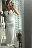 I had it hemmed to fit length of me in my heels, the top was perfect standing still but started to fall as I danced. I didn't wear any bra which I probably could have to fill it up a bit. I received compliments all night and days after. - Elizabeth H.