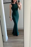 I'm usually a smedium in dresses and have to decide a size based on fabric. This fabric is thick, stretchy, and easy to move around in, and small fits me perfectly! Also, I love the back!! - Miranda R.