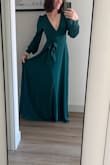 I love the flowy material and color of this dress! I'm usually between sizes (between small and medium), but the medium fits perfectly bc the material does not allow for stretch. The deep V in the front and open back give this otherwise modest dress some pop! - Miranda R.