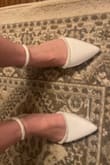 Let me tell you. I'm typically a size 8, and was a ballet dancer when I was a kid, therefore have bunions. Pointy shoes don't typically work for me. I went to Macy's, DSW, Off Broadway Shoes, Nordstrom, JC Penney looking for a flat, elegant bridal shoe with not even an ounce or *potential* shoe tried on. Everything worth looking at was at least 2" or extremely gaudy at those stores. I'm a true size 8 with shoes that have abilities to run wider due to my dance-evolved bunions. After reading reviews, I decided not to get a 7 but to meet halfway with a 7.5 of this shoe. It fits like a glove, feels so comfortable, doesn't seem too slippery. Not to mention they'll look STUNNING in getting ready photos/ little detail pics on my wedding day. If you're looking for a nice flat for your wedding, here it is. Also& have you seen the price??? I feel I spent more on gas driving all over to other shoe stores! 10/10! - Rebecca C.