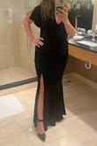 This dress was so comfortable. It has some stretch to it. I had my seamstress stitch up the slit and the v neck a bit as they were a bit high/low for me. Lots of compliments.  
I did notice though that I left small tufts of black velvet wherever I sat, not horrible but wouldn't be good if you had to sit on light colored furniture. Good thing it was a dark venue.  Oh, and the velvet turned my French manicure grey. Wear dark nail polish if you get this dress. - April