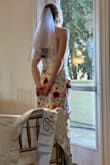 Got this dress for my bachelorette party and bridal shower (I'm the bride). I love the wildflower look and got so many compliments on this dress. I'm glad it fit perfectly because the material is not at all stretchy, and I will say my torso is probably an inch or so longer than the neck thing was designed for, so it tries to pull down a little, but not enough to be a problem. I may even switch to this dress when I inevitably get hot at my wedding reception! The dress is not see through - dark underwear may show a little but anything in the nude spectrum works great. And it's thick enough that no bra was needed (just stickies). - Sarah K.