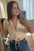 I usually don't like my stomach showing (or my chest) but this shirt is so cute I made an exception! I wore a nude bra under this and it didn't show too much (but the photographer also did a great job of adjusting the shirt for photos). Not too much skin showed either, it's the perfect length. I can't wait to wear it again. - Kelsie H.