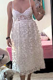 I bought this dress for my bachelorette and rehearsal dinner. The dress is well made. So pretty and almost perfect. I just wish that the bustier was more form fitting to give a more flattering silhouette. The skirt also starts out so poofy. I wish this part was more flared. The shirt has three layers, so I ended up cutting the middle tulle layer in hopes that it would look more A-line but I don't think it made much of a difference. Overall, still a really pretty dress but this maybe better suited for someone with a smaller waist. I ended up keeping it because I didn't have time to look for a different dress. I got lots of complement but I didn't necessarily feel my best wearing it. - Karla N.