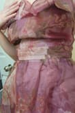 The floral fabric is scratchy. The lining is quite soft so this only presents as an issue with the sleeves. Just trying it on for 5 minutes irritated my arms. Some of the seams are unsightly, mainly the one right below the waistband/tie (pictured). The bodice lacks structure, though I don't know that it'd necessarily slide down without adding structure. In the close up picture, I'm slouching slightly and it folds on itself. I just prefer a bodice of this style to be more supportive. All that being said, it still looks like the picture and I think it's very pretty. I will, however, still be putting some work into it because I don't find it wearable as is. - Kim J.