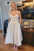 I wore this for my bridal shower tea party and it was exactly what I was looking for! The fabric is a thick, nice material and it feels well constructed. Pockets always get bonus points too! - Mackenzie O.