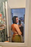 Love this shirt, just wish the back and sides were more flush to skin. They stick out a bit no matter what size you get. It's just the cut of the shirt and can't tell on the model. Also wish was thicker, can definitely see nips. Good quality and beautiful color, true to size. Keeping! - Tiffany P.