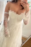 This fits true to size and is exactly as pictured. This is a beautiful dress for what you pay.
I'll be wearing this for an elopement shoot in the PNW and am so so excited to wear it! The lace is of great quality and the dress fits nicely. My only complaints are the cups and waist... I'll most likely be taking the cups out because they are just too stiff, and I would have preferred a lower waistline as this really emphasizes a short torso. Overall worth the buy!! - Angelica R.