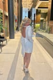 I wore this for my bachelorette night out and I just loved it. I was comfortable and the fit was perfect. I received sooo many compliments on the dress. I did use safety pins to secure the bow because the button did not work well, but overall a fabulous dress - Heather P.