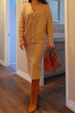 I had purchased a small originally, and while the cardigan looks to meant as oversized, there's a fine line between it draping relaxed on your body and it looking frumpy. That was the case; not to mention that the skirt also didn't sit tapered but rather felt loose towards the bottom, so I could only imagine how it would stretch out with wear. I exchanged for an XS (and by no means am I ever an XS) and it fit perfect. I love that I can wear them as separates and or dress it up with heels. I even wear casually with mules or boots depending on the weather. - Nan T.