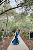 This dress doesn't have stretch, but flowed beautifully and covered my belly that I'm insecure about. It was nice and cool with the slit while dancing at the reception. It was a little too showy on the cleavage, but I had a scarf that helped cover it. It was a perfect dress for the black tie wedding I attended. - Amanda J.