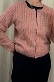Is very soft; I can't tolerate itchy/scratchy. I usually buy medium tops; this sweater in medium is perfect. Cropped, which I love. Tends slightly mauve than a true pink. Very pretty. Sleeve length is perfect. - Lori F.