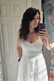 This dress is beautiful in person. It has a modest length, and fits perfectly. The waistline is incredibly flattering. - Cassaundra D.