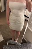 I ordered this dress for my rehearsal dinner. It's really cute on and fits well. I noticed that the top sheer part doesn't have any flowers on it like in the picture. I emailed customer service and they told me the item was defective and sent me a new one. The one they sent me looks exactly like the original one I got. I added pictures of the original dress and the one they sent me. - Kelly K.