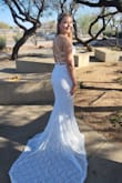The material was delicate and smooth, with amazing lace detail but also heavy duty. I truly felt like a princess on my wedding day and received nothing but praises about the dress! - Emma W.