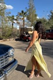I loved this dress. The way it hugged all the right areas, but still enough room to move in. I love the slit and adjustable straps on the back. It was a great material and it was easy to wash after. It was a perfect height paired with my three inch heels and I'm 5'2" - Oceana S.