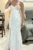 The floral appliqués have small clear sequins that sparkle and are so pretty. The cups are big enough (32DD) and the lace up back makes a really good fit. The way that the front tapered down from the cups to the top of the skirt makes my waist look so snatched. - Darla H.
