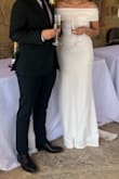 Runs just a smidge small, but not enough to size up. It was so beautiful, simple and classy!! It is a bit long. I wore 4 inch heels. - Giselle A.