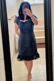 The dress is chic and the material nice.  I originally ordered a small but was too small at the torso. So I exchanged it for a medium. It was a little big at the waist but not too bad. I didn't like how long the chiffon at the bottom of the dress was so I had it altered, and I took the extra fabric and moved it at the chest.  I don't like showing too much cleavage - Mary P.