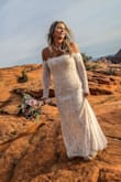 I was so comfortable. So gorgeous. It was lined lace and off the shoulders with thick white lace detailing around the neckline. Just the right length of train for the outdoor wedding we had. - Andrea M.