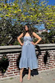 This dress fits beautifully and flows perfectly! The fabric is so nice and elegant with nice texture and the trim just adds that extra Lulus touch to this dress. Fabric has no stretch since it's woven but still very nice quality. I wore this out to the museum with my kiddos and received a lot of compliments. Definitely recommend this dress! - Maria M.