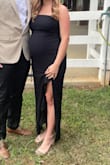 Wore this dress at 32 weeks pregnant (close to 150lbs). Normally, I am a small, so I ordered a medium to be on the safe side, and it fit perfect. It has a good amount of stretch, so it fit my curves (belly) perfect. I am no longer pregnant and almost back to pre-preg weight (133 currently) and it still fits great! - Katie M.